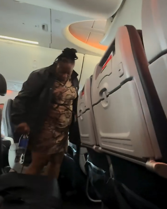 Passenger being removed from airplane aisle, highlighting entitled passenger kicked off flight after telling attendant to shut up. Passenger being removed from airplane aisle, highlighting entitled passenger kicked off flight after telling attendant to shut up.