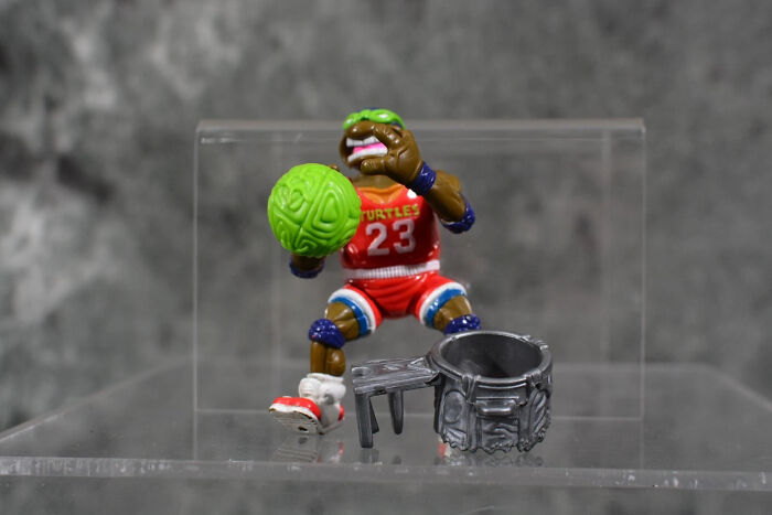 Vintage toys worth fortune featuring a detailed Teenage Mutant Ninja Turtles basketball figure and accessories on display.