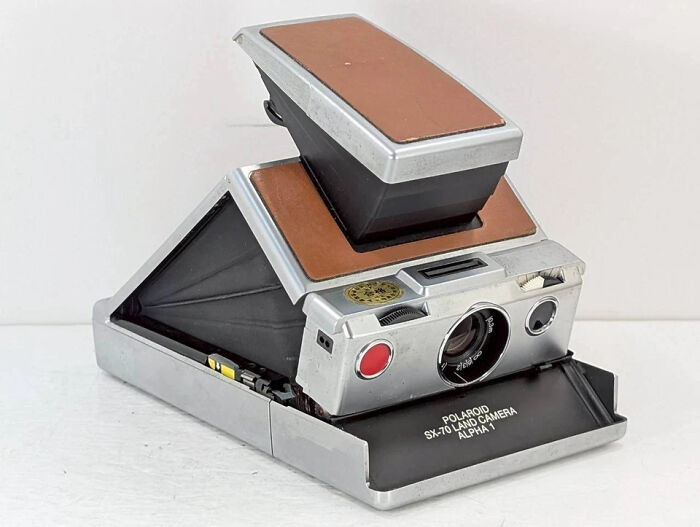 Vintage toys worth fortune featuring a classic Polaroid SX-70 Land Camera Alpha 1 in silver and brown.