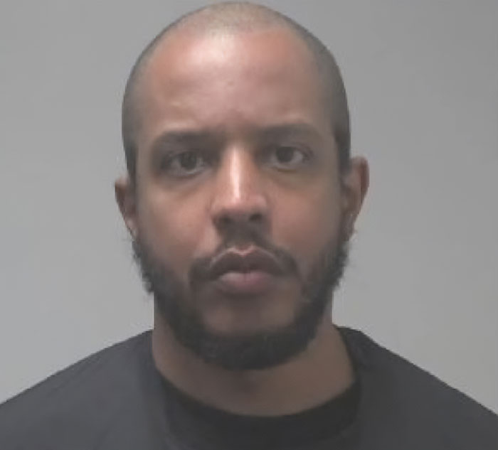 Man with short hair and beard facing camera in police photo related to major breakthrough in cold case of boy.