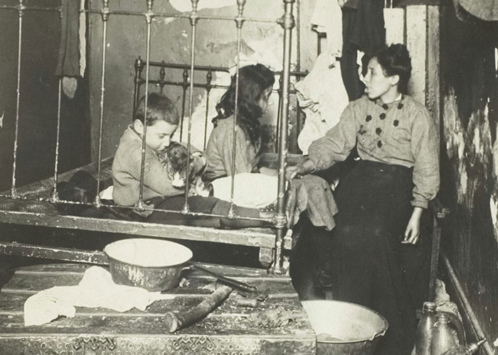 Vintage black and white photo of a family in a small room, reflecting dark secrets people found out about family members.