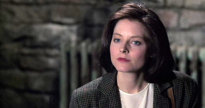 Female character in a movie scene portraying a well-written genuine woman breaking stereotypes with a thoughtful expression.