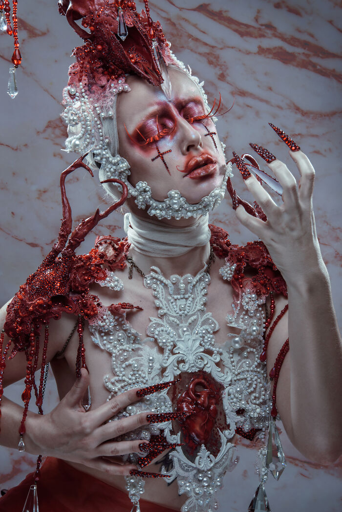 Elaborate Halloween makeup and costume transforming a loved one into a haunting Halloween character with intricate red and white details.