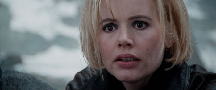 Close-up of a well-written female character in a movie, portraying genuine emotion and breaking stereotypes.