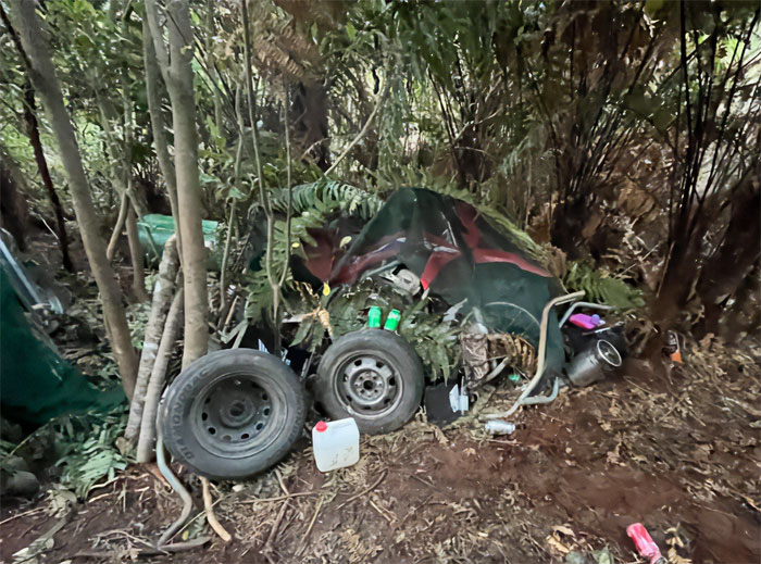 Campsite photos showing abandoned gear and tires in dense wilderness linked to mom of kids who vanished.