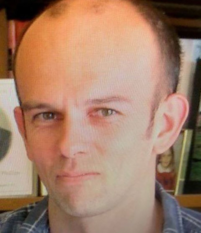 Close-up of a man with a serious expression linked to mom of kids who vanished into wilderness case.