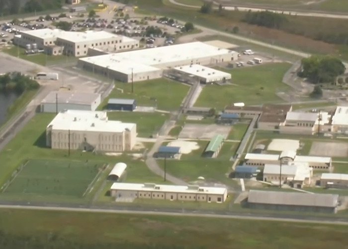 Aerial view of detention center with hundreds of detainees reportedly missing from ICE records after transfer.