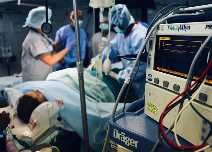 Medical team performing surgery with advanced monitoring equipment showcasing unexpected industry secrets in healthcare setting