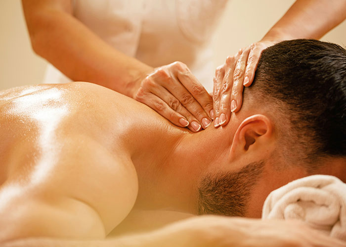 Close-up of a person receiving a relaxing neck massage revealing unexpected industry secrets in wellness and therapy.