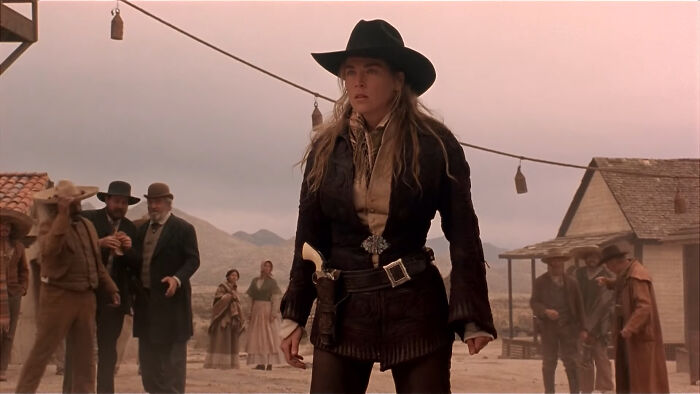 Female character in a western setting portraying strong, well-written traits that break movie stereotypes and feel genuine.