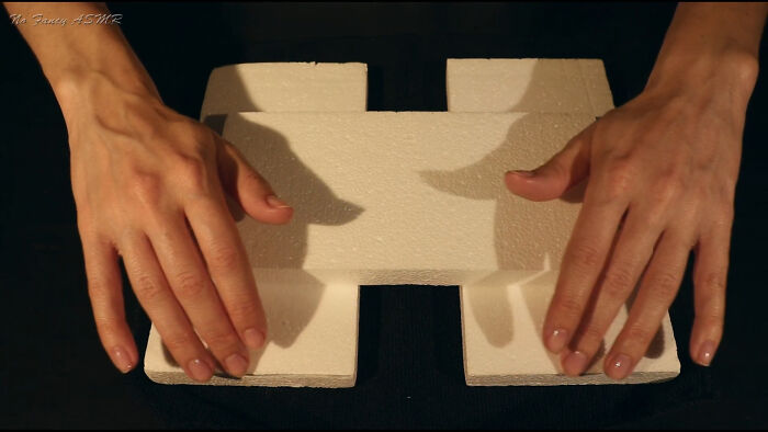 Hands creating sounds by tapping on white foam blocks, illustrating people share sounds extremely angry in ASMR style.