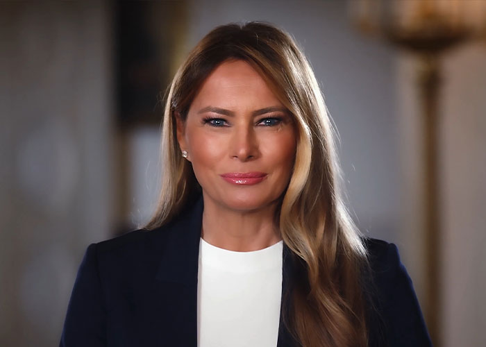 Melania Trump wearing a navy blazer and white top during the state visit, linked to British royals curtsy question. Melania Trump wearing a navy blazer and white top during the state visit, linked to British royals curtsy question.