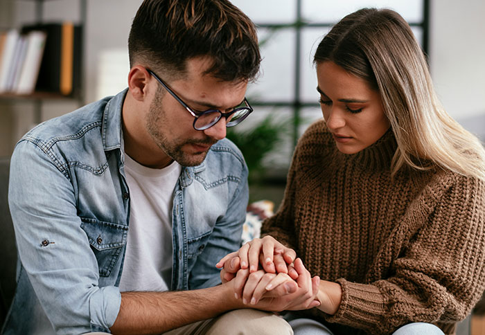 Husband and wife having a serious conversation, wife&rsquo;s reaction to husband attending sister&rsquo;s baby shower causing tension.