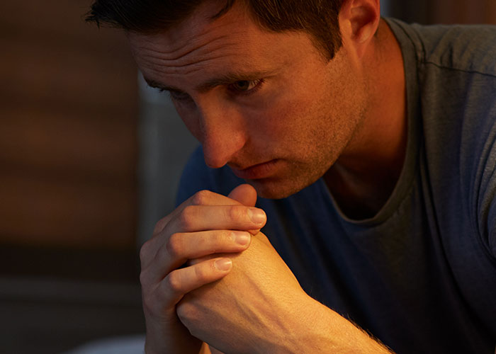 Man looking worried and contemplative, highlighting a moment of realizing a real problem and planning an exit strategy. Man looking worried and contemplative, highlighting a moment of realizing a real problem and planning an exit strategy.