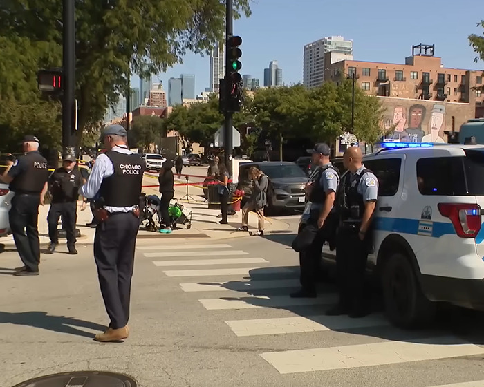 Police secure a Chicago street scene after mom is fatally shot following dropping off son with loving note in lunchbox.