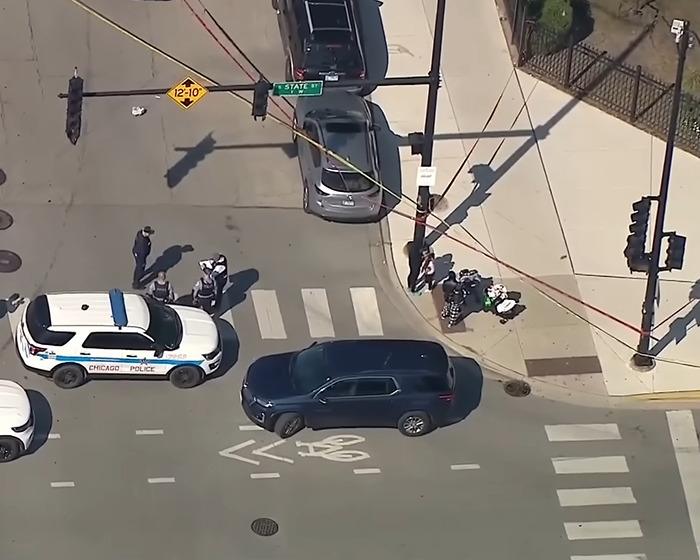 Aerial view of police and emergency responders at scene where mom is fatally shot after dropping son off.