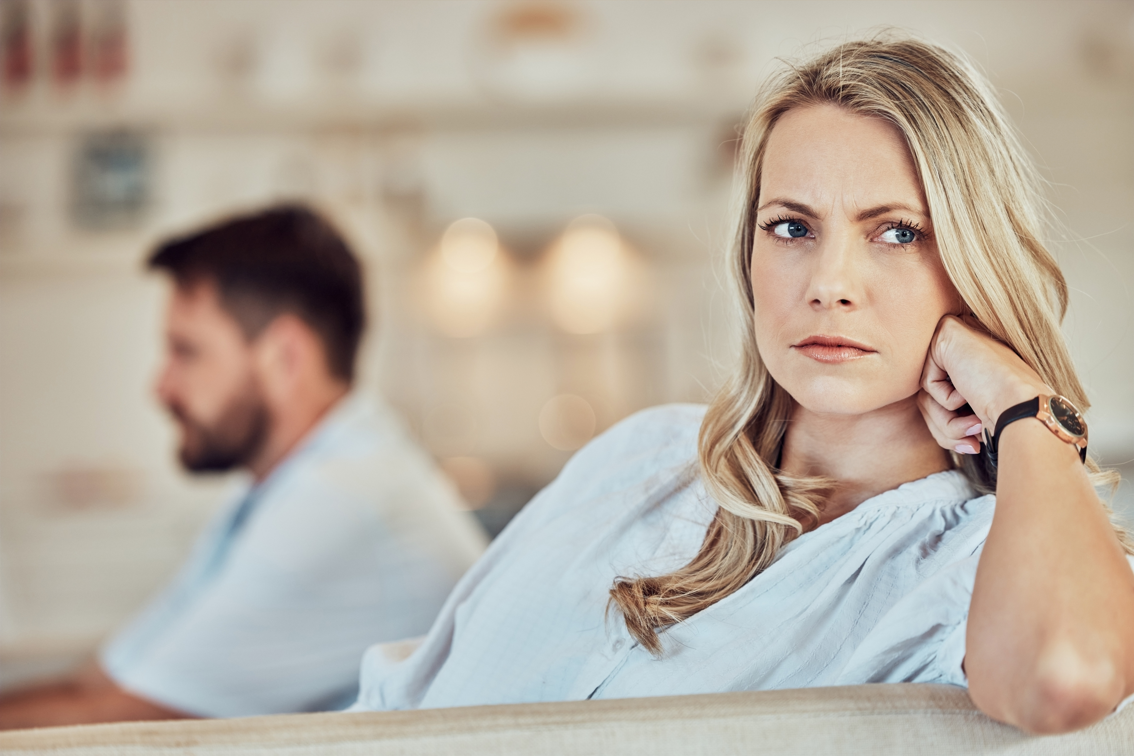 Woman moves out after breakup looking upset while ex-partner insists she pay half for house upgrades left behind.
