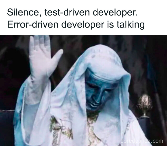 Meme showing a figure in white robes with hand raised, captioned about test-driven and error-driven developers in programming.
