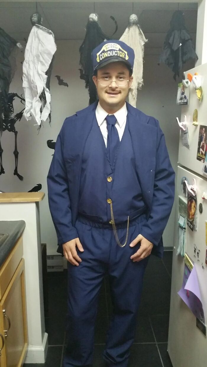 Man dressed as conductor from Polar Express, part of 14-year Tom Hanks transformation project and cosplay series.