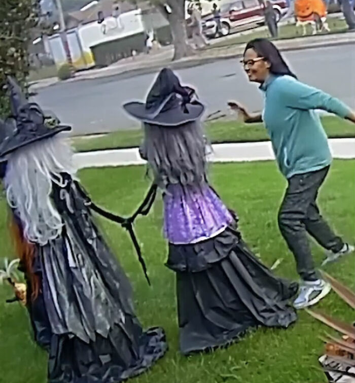 Unhinged woman caught attacking Halloween witches decorations twice on neighbor's lawn in viral footage.