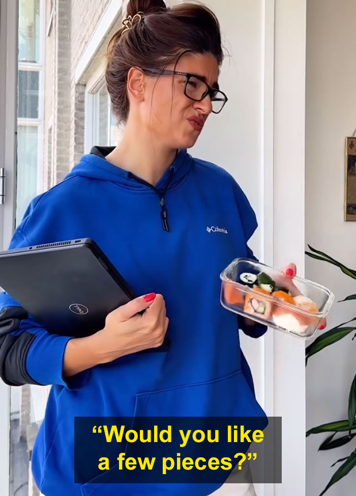 Woman in blue hoodie holding sushi with a confused expression, illustrating Bulgarian finds Dutch don’t share food freely. Woman in blue hoodie holding sushi with a confused expression, illustrating Bulgarian finds Dutch don’t share food freely.