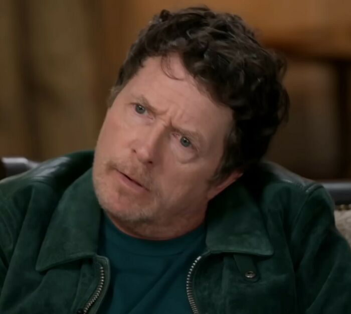 Michael J. Fox looking serious during an interview sharing a heartbreaking update on his health struggles.