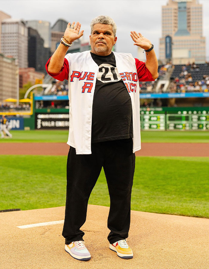 Man wearing Puerto Rico baseball jersey standing on pitcher's mound, representing famous men shorter than fans imagined.