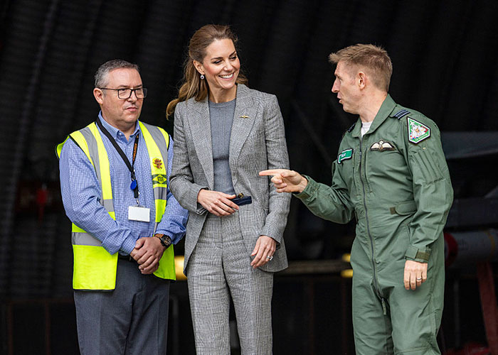 Kate Middleton engaging with servicemen, sparking a firestorm of hilarious reactions during a visit to a military hangar.