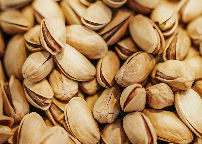 Close-up of pistachio nuts illustrating useful life hacks people discovered accidentally and still use today.