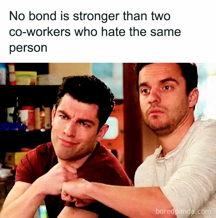 Two co-workers fist bumping with text about bonds formed from shared dislike, relatable work memes humor.