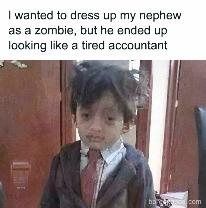 Child dressed in a suit with messy hair looking tired and worn out, illustrating relatable work memes and humor.
