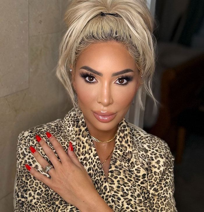 Farrah Abraham posing with red nails and leopard print top amid controversy over pelvic tattoo for her 16-year-old daughter. Farrah Abraham posing with red nails and leopard print top amid controversy over pelvic tattoo for her 16-year-old daughter.