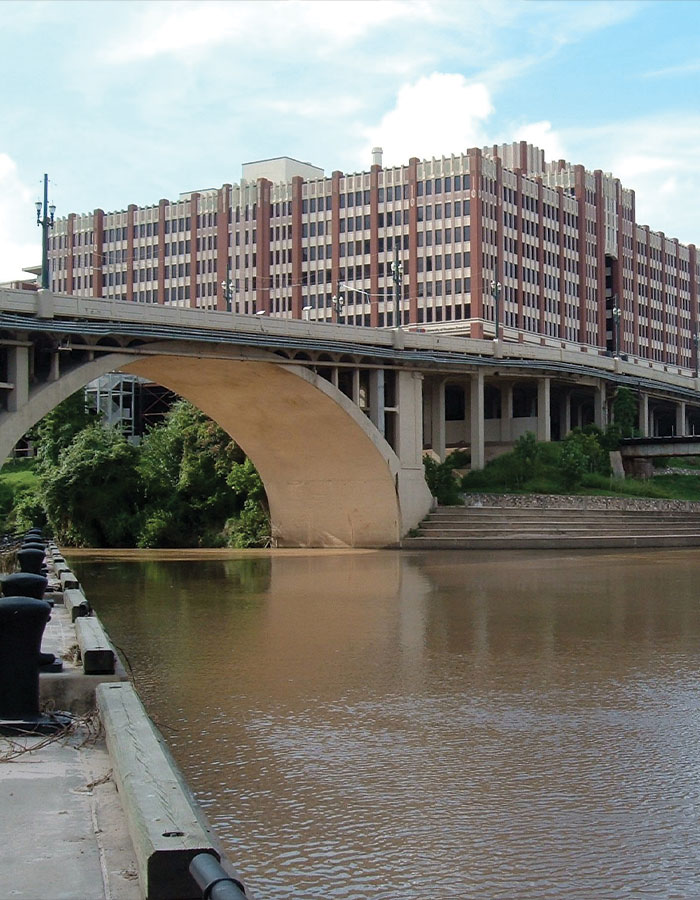 Bridge over river with urban building in Houston, related to fears of serial criminal as 16th body found in the city.