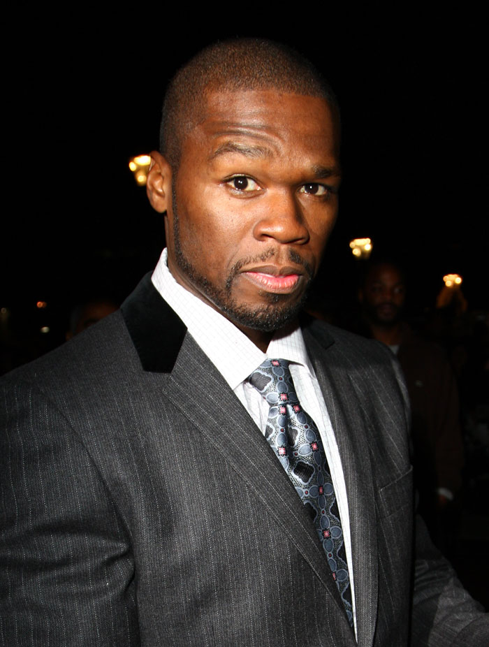 Man in pinstripe suit and patterned tie at night, representing hard rock cover of 50 Cent's many men going viral.