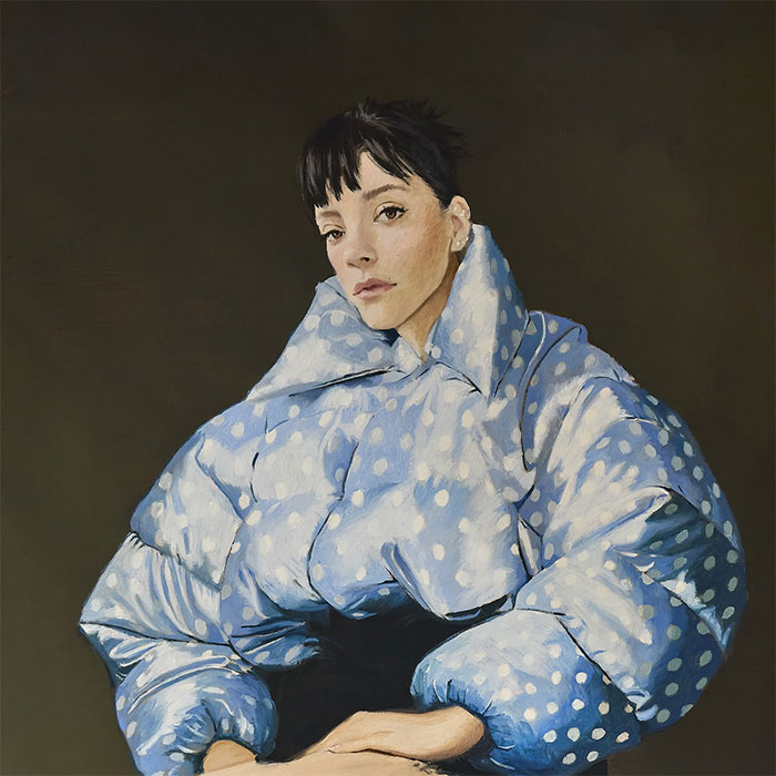 Portrait of Lily Allen in a blue polka dot puffer jacket, representing Lily Allen's explosive new album insights.