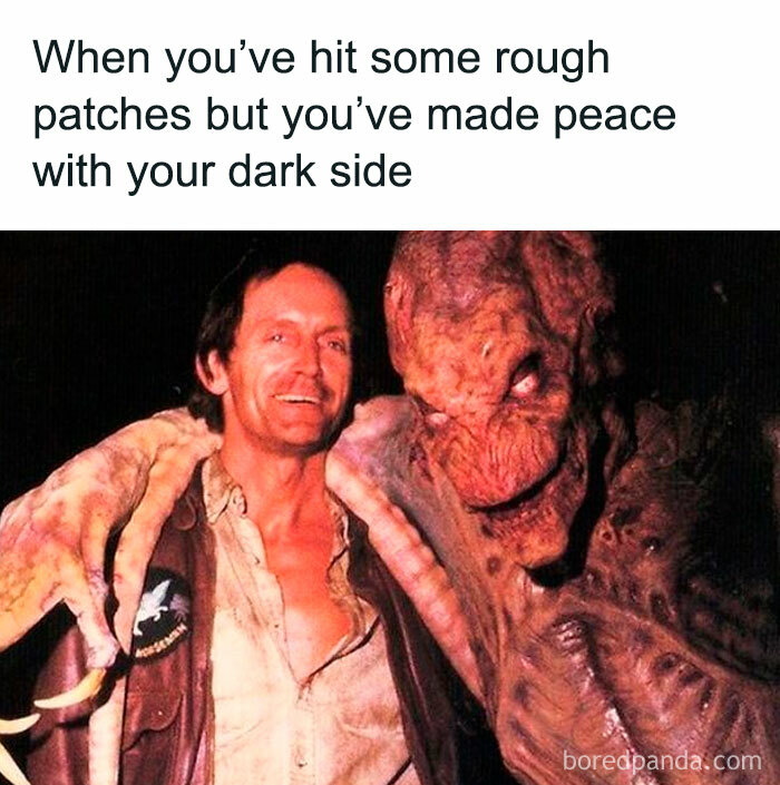 Man smiling with his arm around a horror movie monster, illustrating hilarious horror movie memes about embracing your dark side.