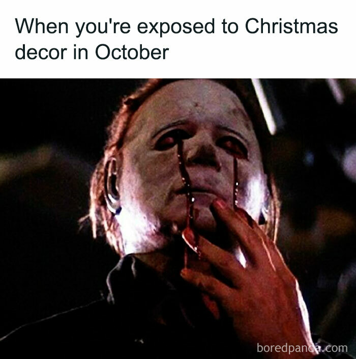 Horror movie meme showing a masked character with fake blood tears reacting to early Christmas decor exposure.