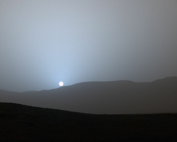 Sunrise over a dusty, rocky landscape captured in an epic astronomy photo showing the beauty and mystery of space.
