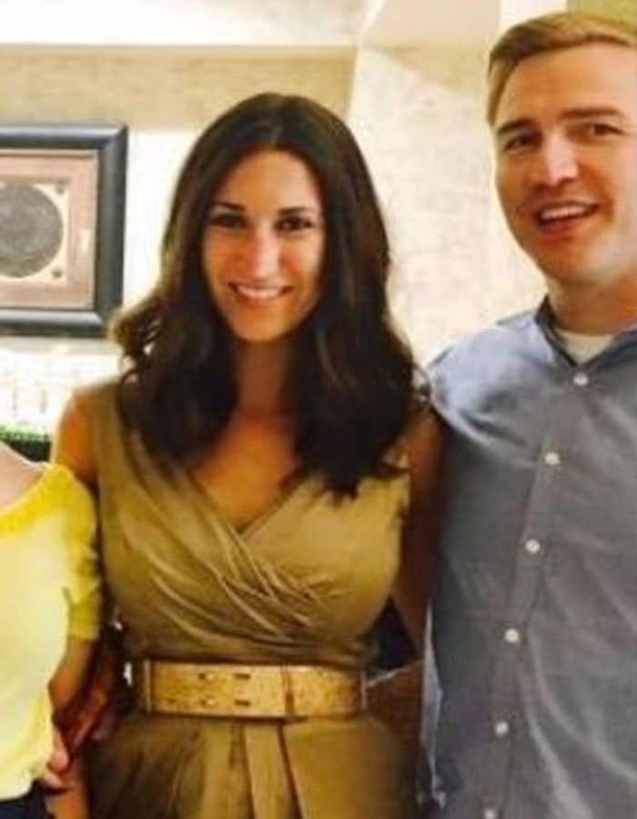 Woman in a gold dress smiling indoors with a man, related to major twist in case of mom who left 6-month-old baby alone on beach.
