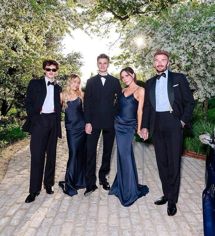 Victoria Beckham and family dressed formally outdoors, highlighting rumored family feud and shade at Brooklyn's wife Nicola Peltz.