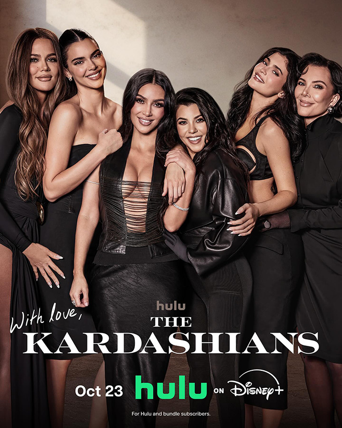 Kim Kardashian and family posing together promoting The Kardashians on Hulu amid 1969 moon landing controversy.