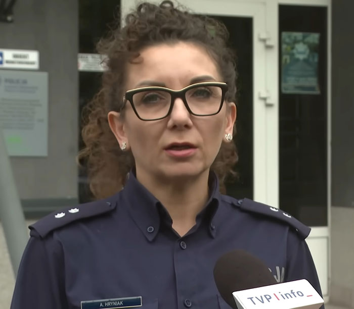 Police officer wearing glasses speaks outside a building about teen missing 27 years found in parents&rsquo; house in poor condition