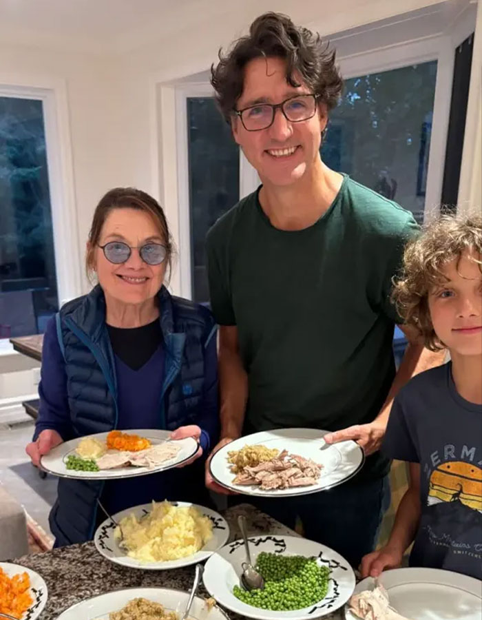 Justin Trudeau serving a meal with family, linked to insiders branding his romance as a midlife crisis after divorce.