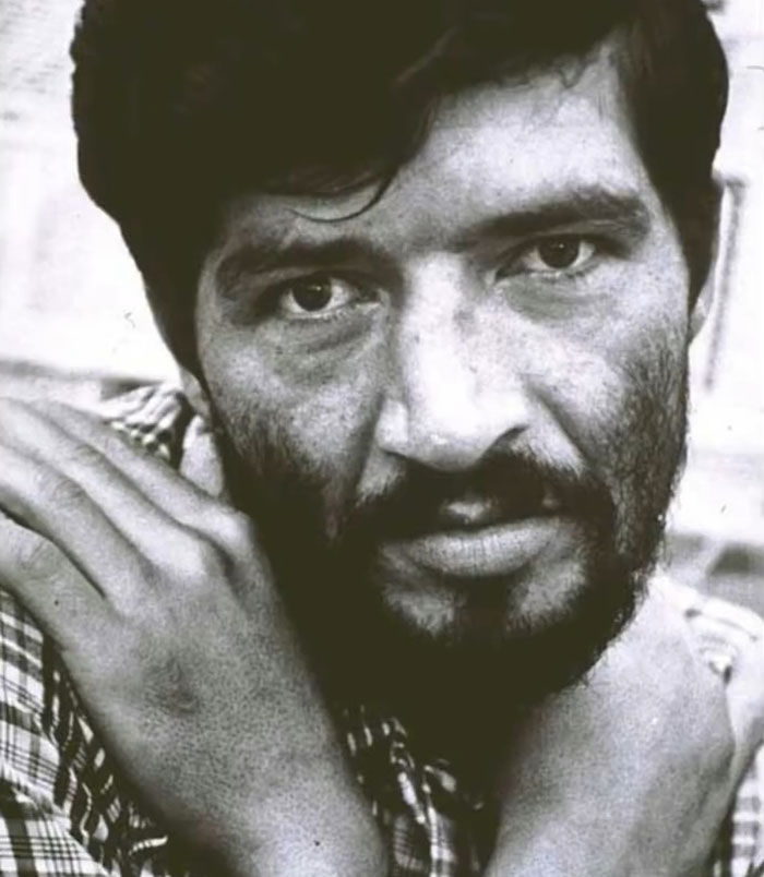 Black and white close-up of a man with a beard and intense eyes, linked to the monster who strangled young girls.