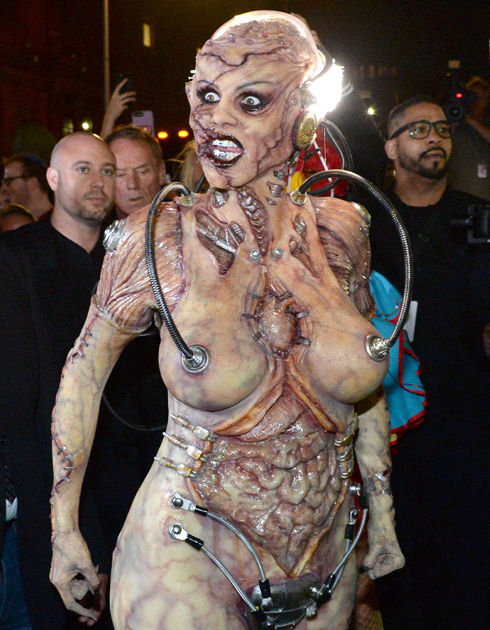Heidi Klum in a detailed horror costume with biomechanical elements, showcasing a nightmare-level 2025 Halloween look.