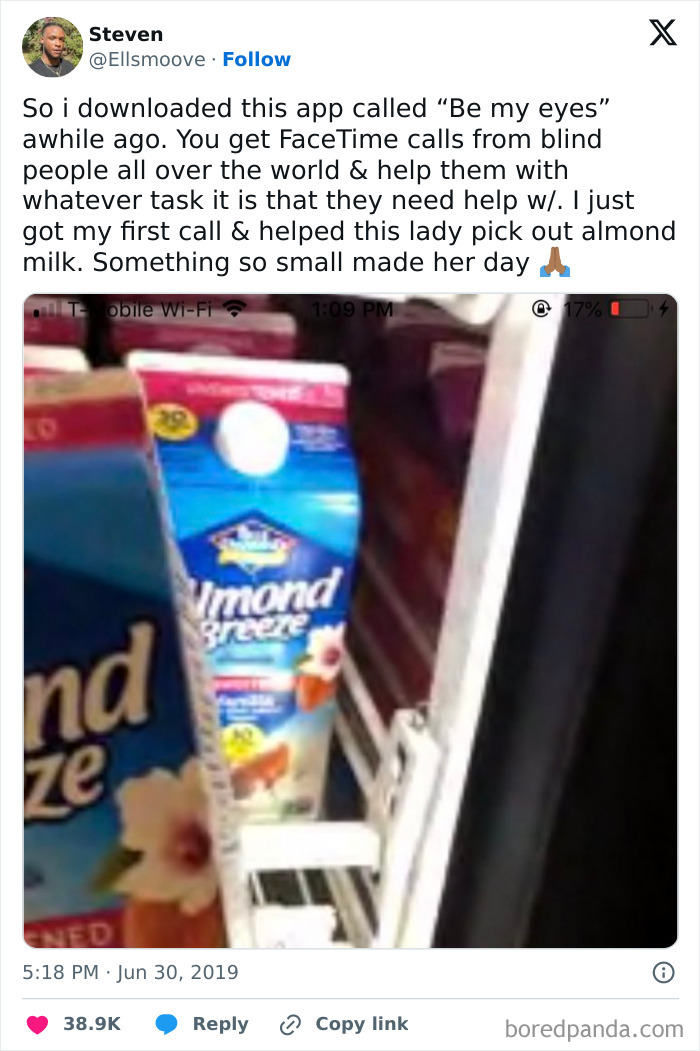 Screenshot of a tweet about using the Be My Eyes app to help a blind person pick almond milk, showcasing faith in humanity restored.