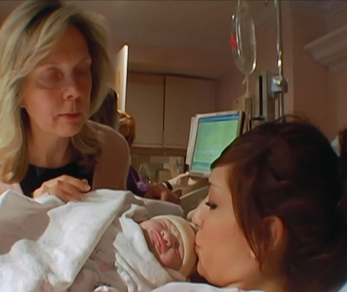 Farrah Abraham with a newborn baby in a hospital room, highlighting controversy over pelvic tattoo on teen daughter. Farrah Abraham with a newborn baby in a hospital room, highlighting controversy over pelvic tattoo on teen daughter.