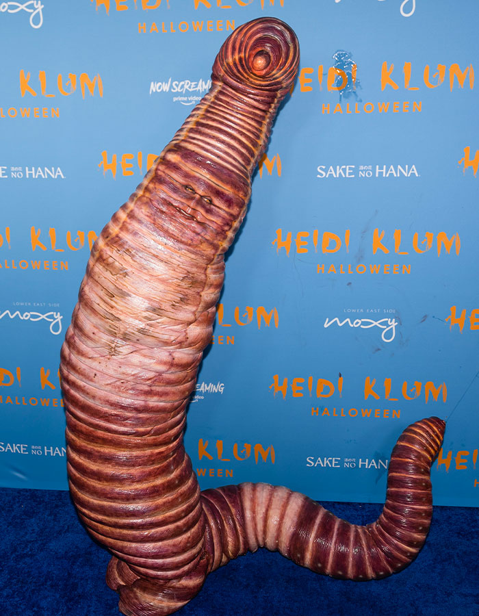 Heidi Klum in a detailed, nightmare-level 2025 Halloween costume resembling a large segmented worm.