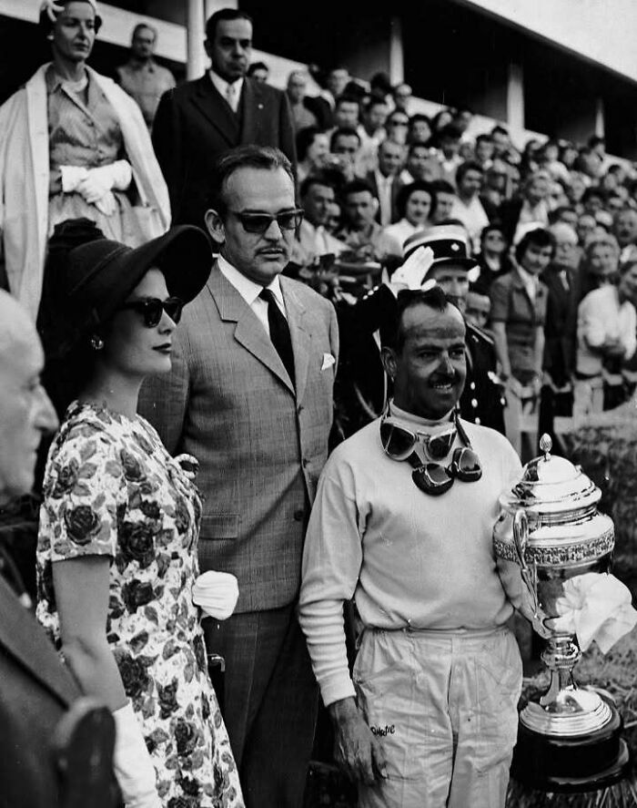 Vintage black and white photo of people gathered at an event, highlighting those who left a mark in movie and music industries.
