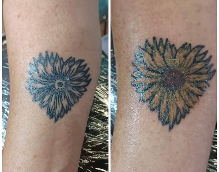 Close-up of a unique heart-shaped sunflower tattoo on a person's arm, showcasing unusual tattoo designs.